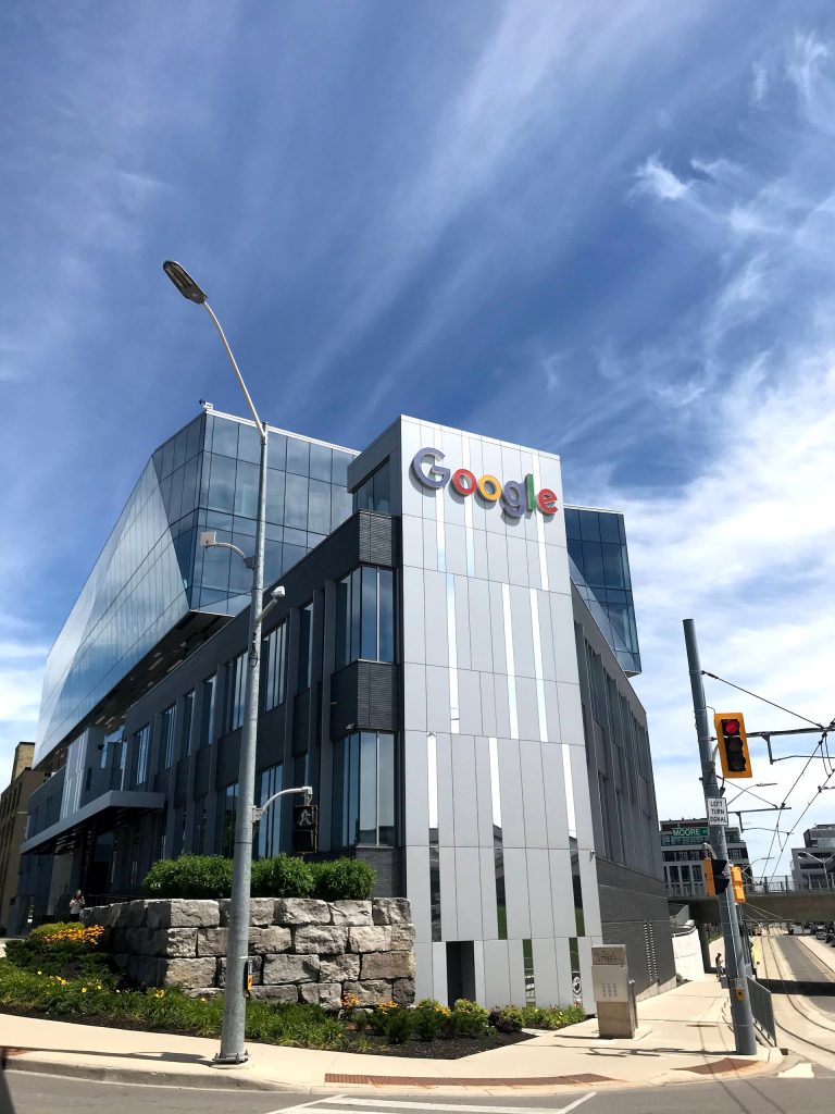 Google headquarters in a modern building under a blue sky